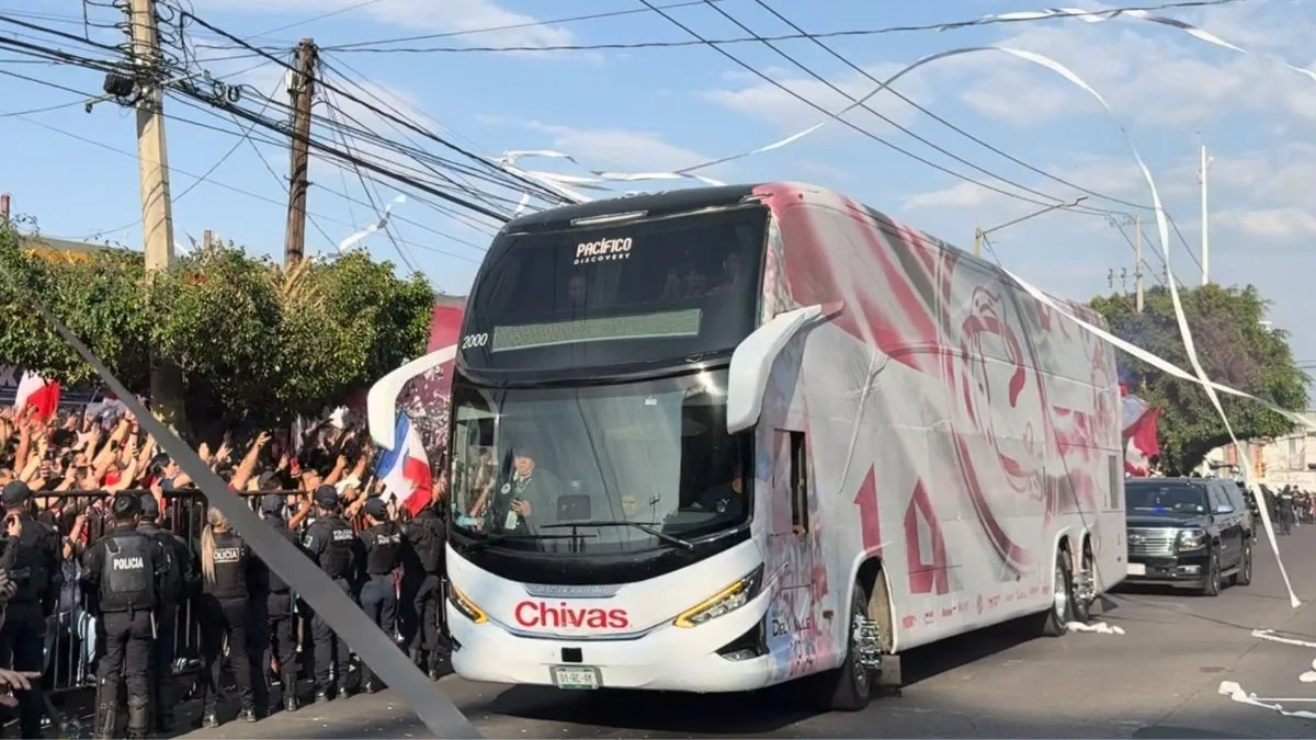Chivas supporters welcome the team bus before a Liga MX match in 2026