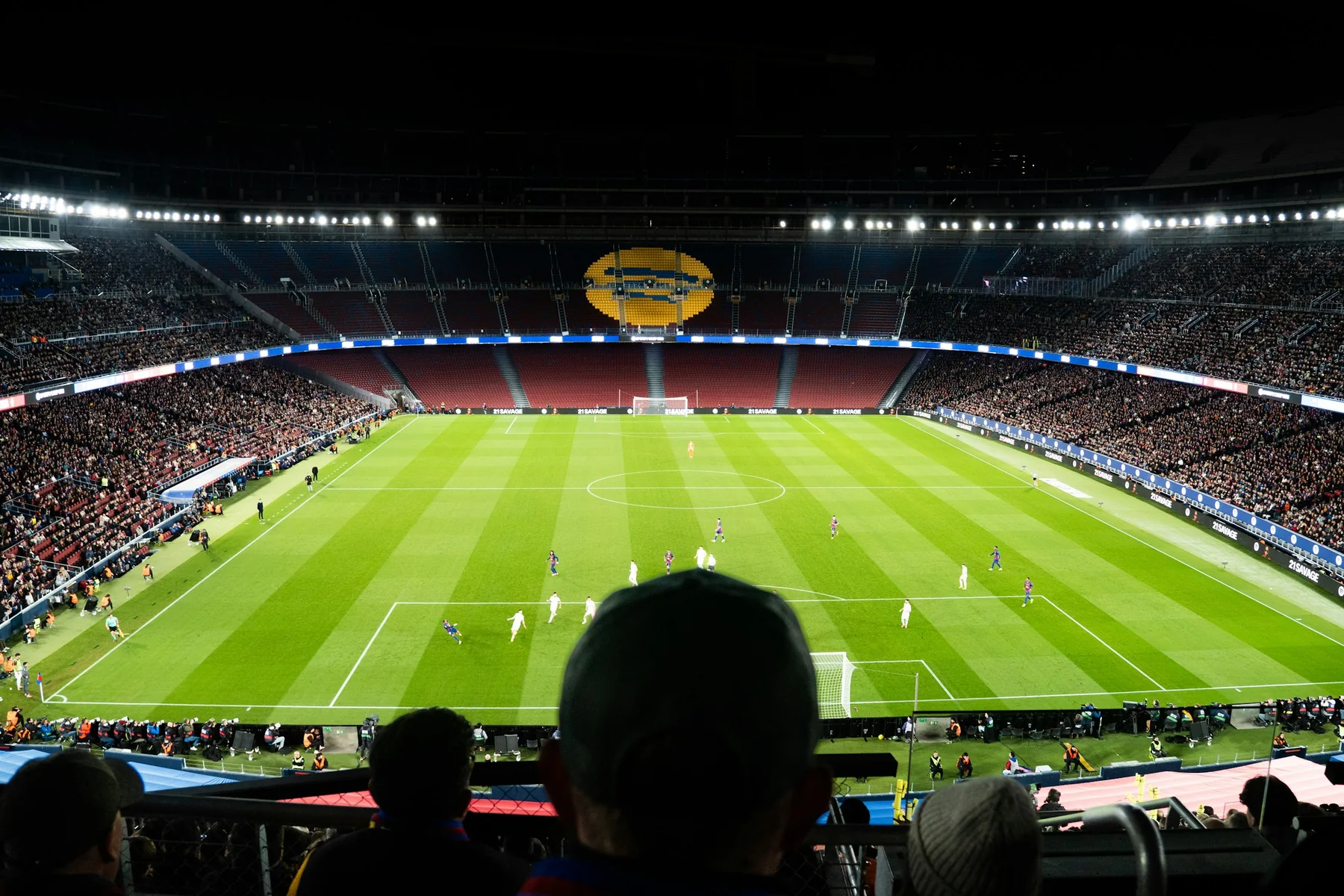 Crowded football stadium during a night match