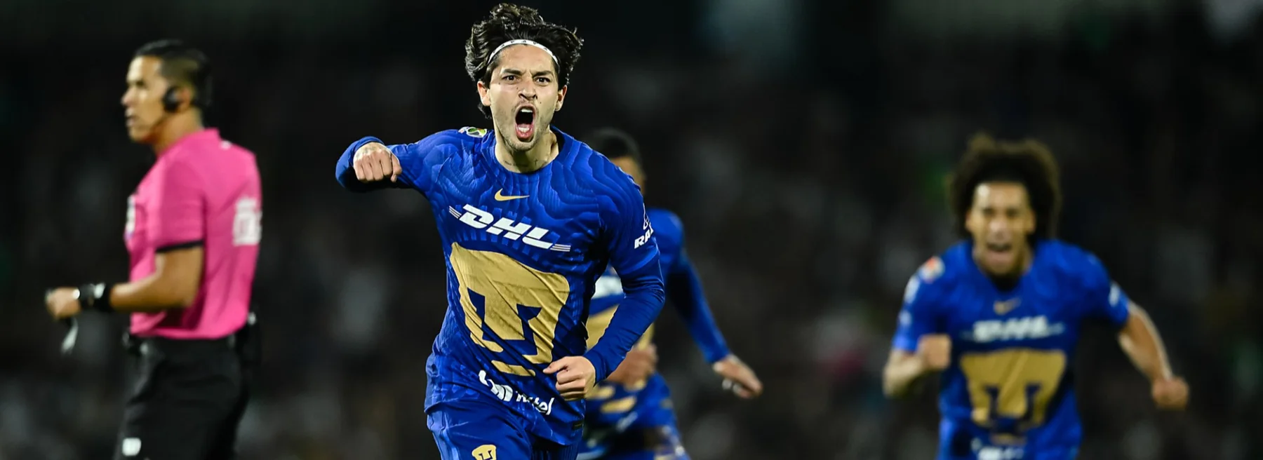 Pumas player celebrating during a Liga MX match